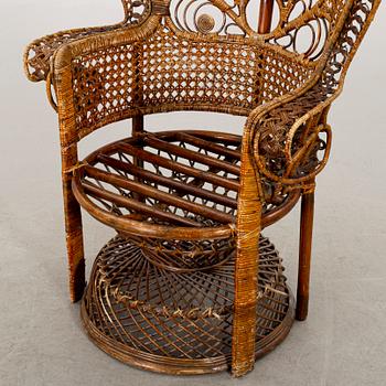 A RATTAN ARMCHAIR.
