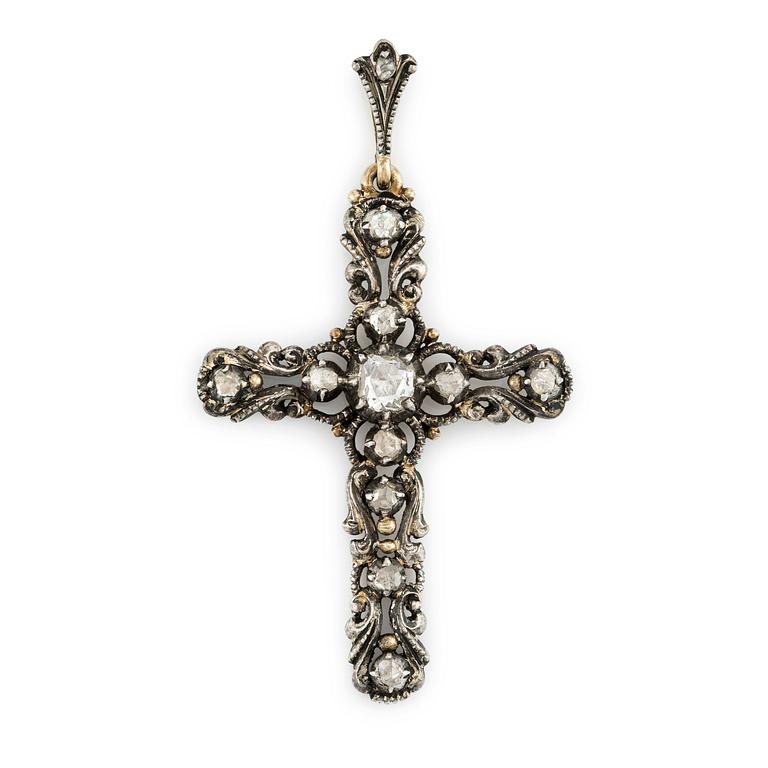 A silver and 14K gold cross with rose-cut diamonds.