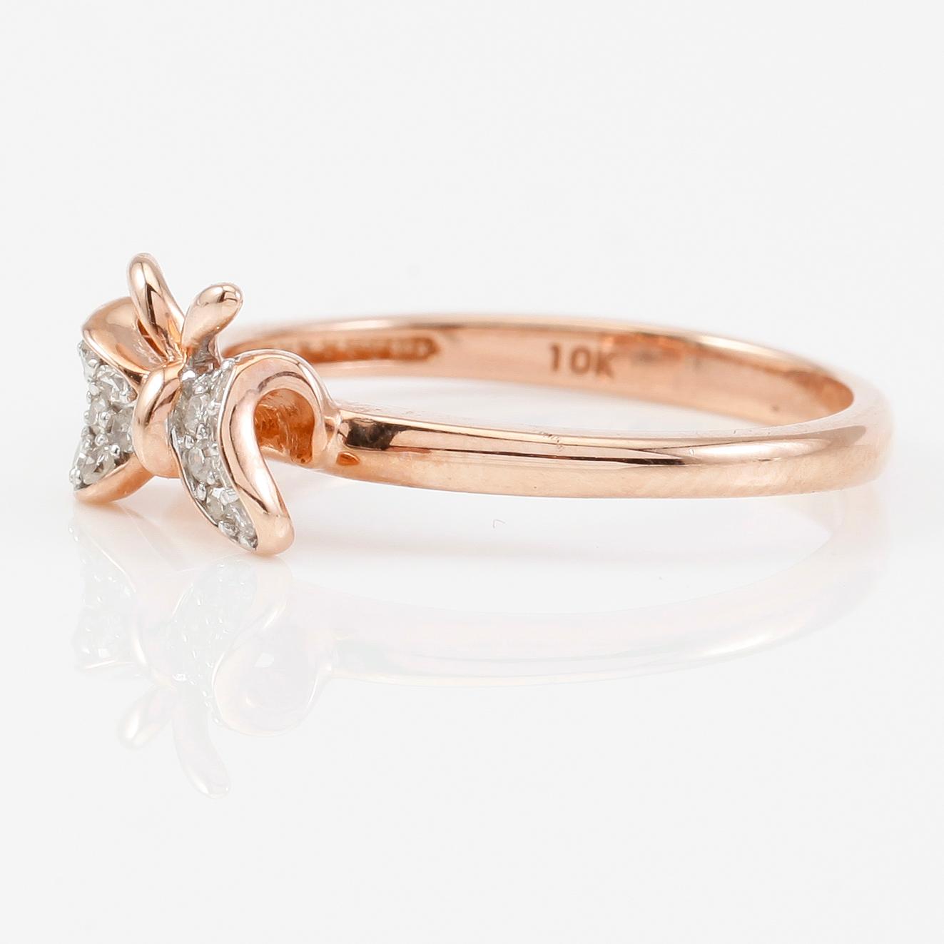 RING, 10K roséguld och diamanter tot ca 0.10 ct.