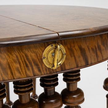 Dining table, circa 1900.