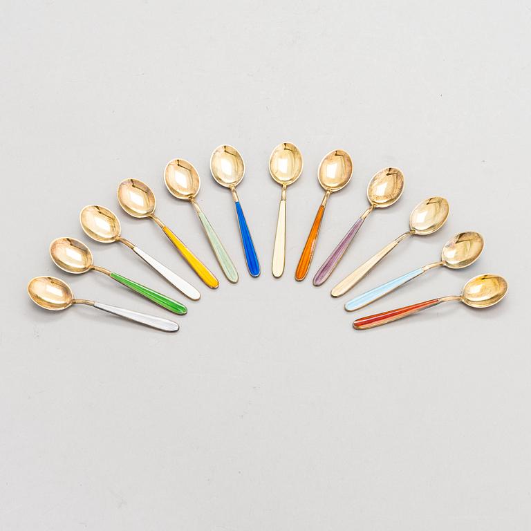 Tillander, a set of twelve enamelled gilt silver spoons, Helsinki 1951.