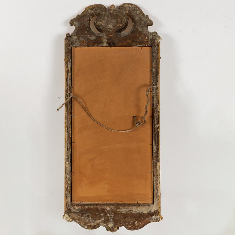 A rococo mirror, mid 18th century.