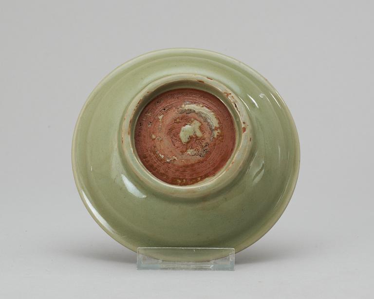 A celadon green Ming plate.