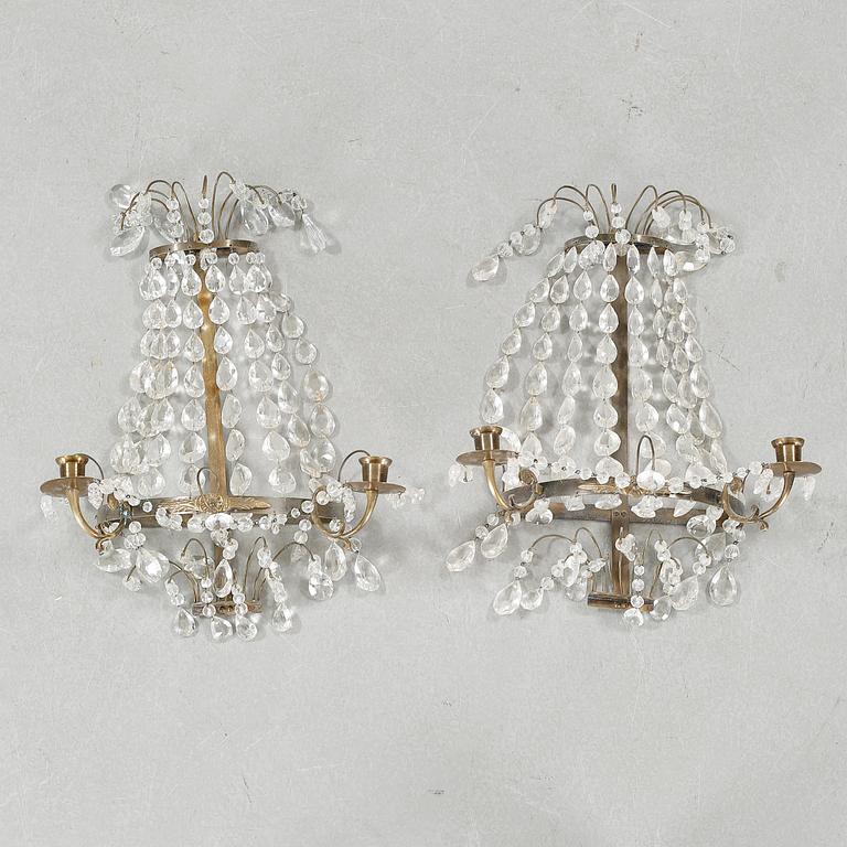 A pair of wall chandeliers from the first half of the 20th century.