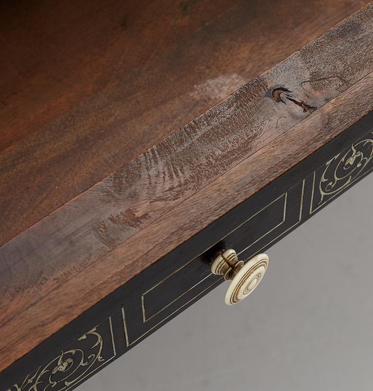 A Renaissance-style ebony, ebonized and ivory-inlaid library table, late 19th century, presumably Germany.