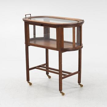 An oak tea trolley, early 20th Century.