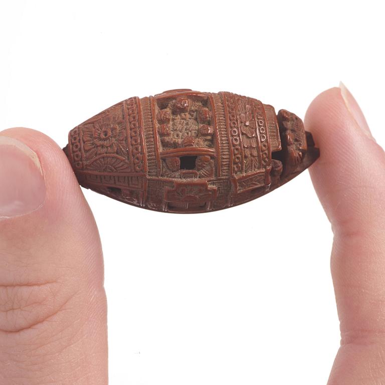 A Chinese nut boat sculpture, with poem.