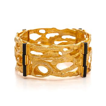 Björn Weckström, an 18K gold and tourmaline 'Sacrificial fire' bracelet. Lapponia 1971.