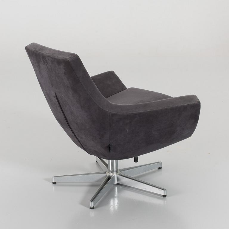 A SWEDESE SWIVEL ARMCHAIR.