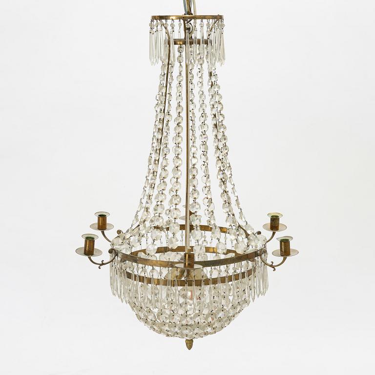 An Empire-style six-branch chandelier, circa 1900.