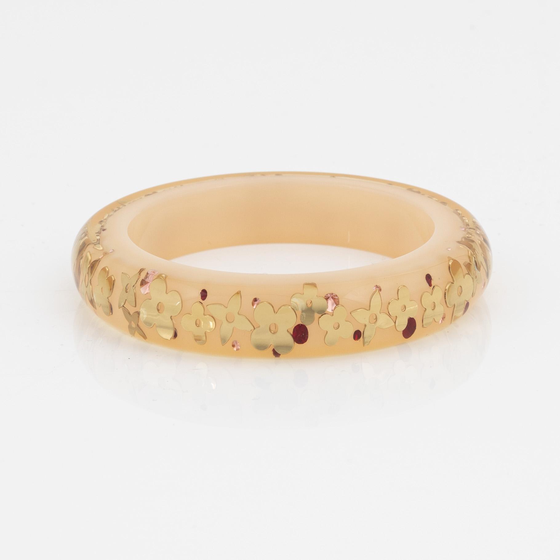 Louis Vuitton, inclusion bangle.