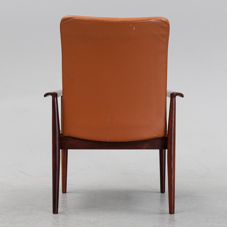 Finn Juhl, a rosewood easy chair, from Cado, Denmark, 1960's/70's.