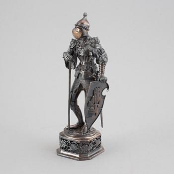 A silver knight figurine in case, pseudo marks.