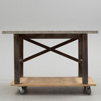 A Limestone and wood table.