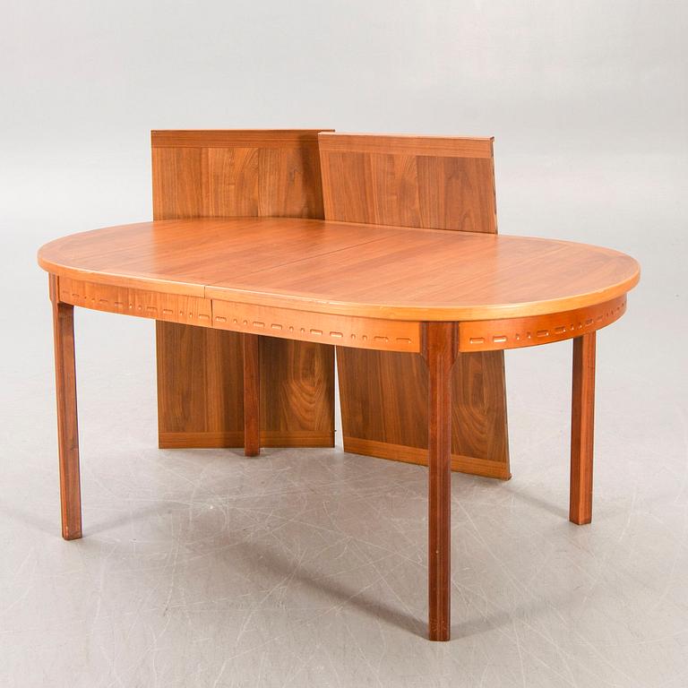 A Nils Jonsson teak and walnut 1960s dining table.
