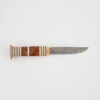 A reindeer horn knife, signed AL.