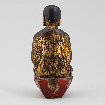 A wooden Japanese sculpture of a deity, 19th Century.