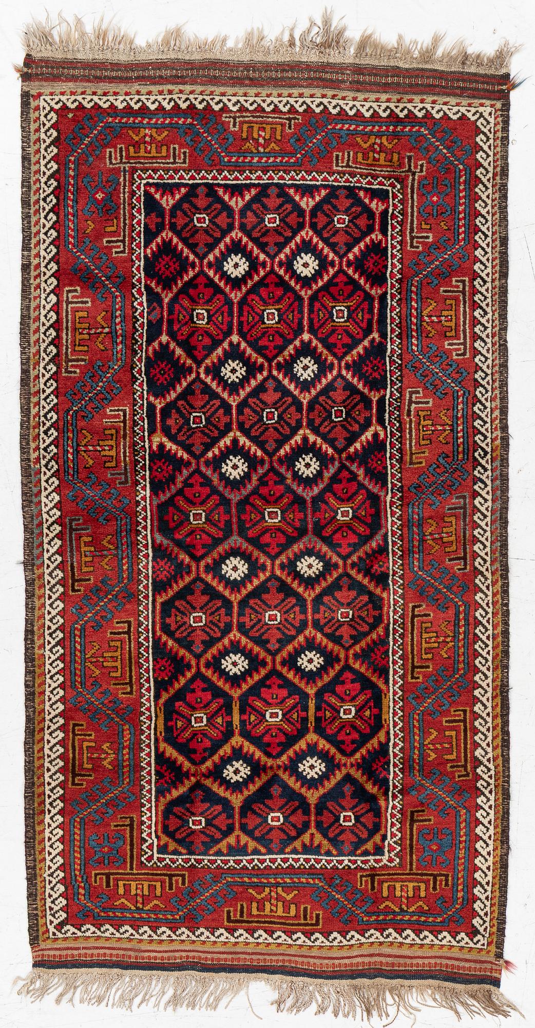 An antique Baluch rug, east Persian, ca 203 x 101 cm.