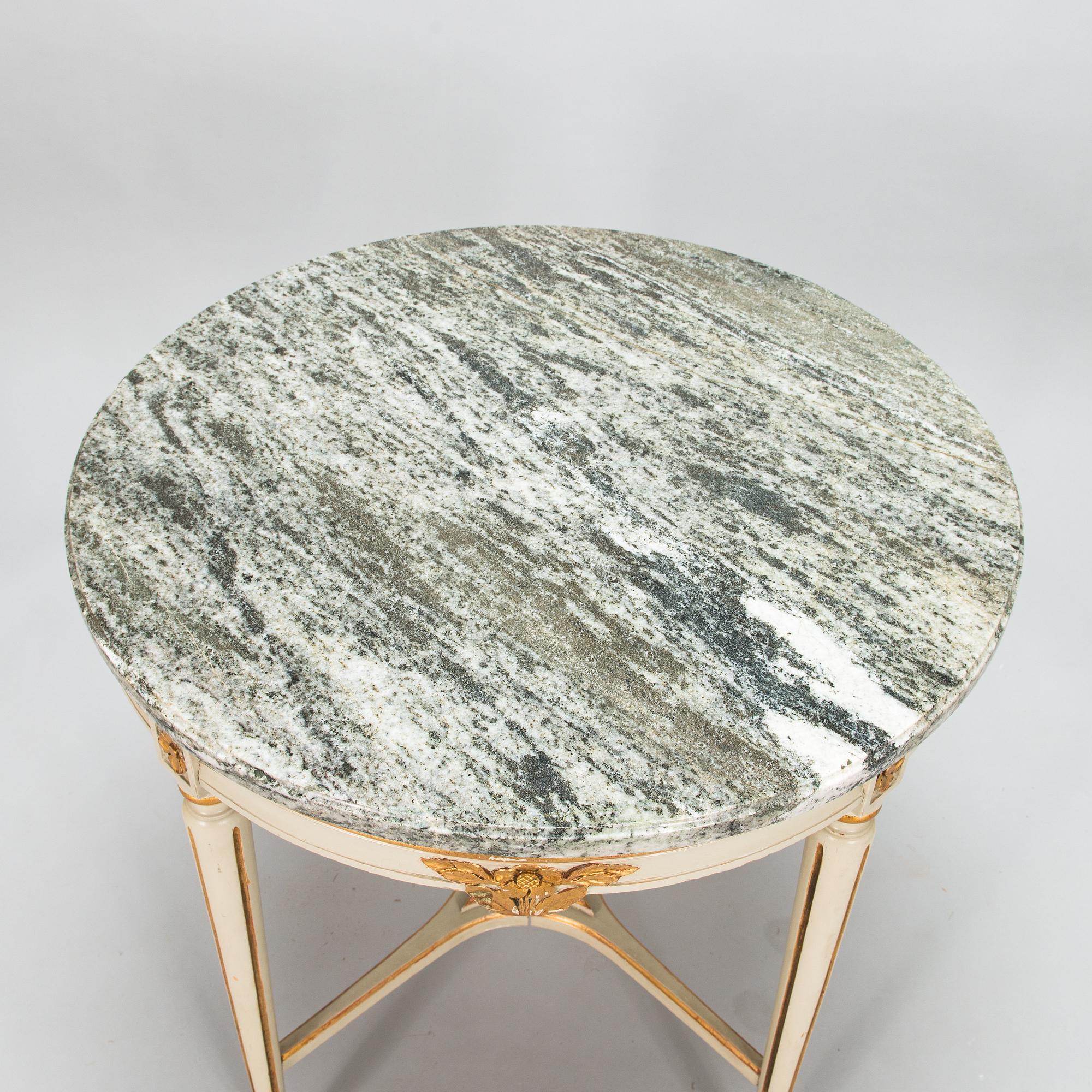 A Gustavian style sofa and table from early 20th century.