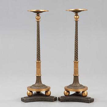 A pair of late Gustavian early 19th century candle stands.