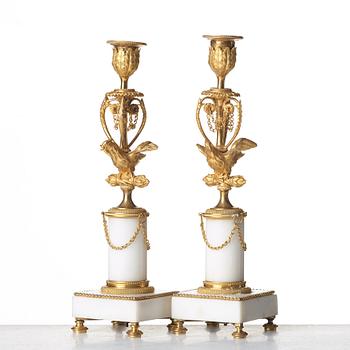 A pair of Louis XVI late 18th century candlesticks.