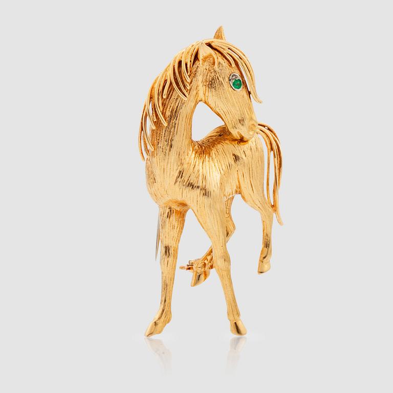 A Van Cleef and Arpels "horse" brooch. Signed and numbered 101077. Made in the 1960's.