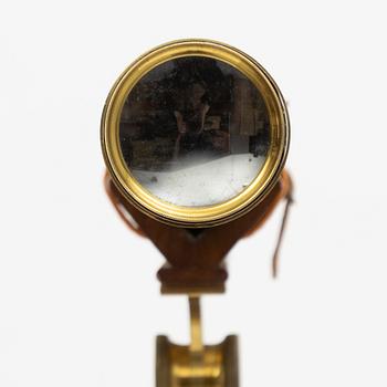 A 20th century telescope on a tripod.