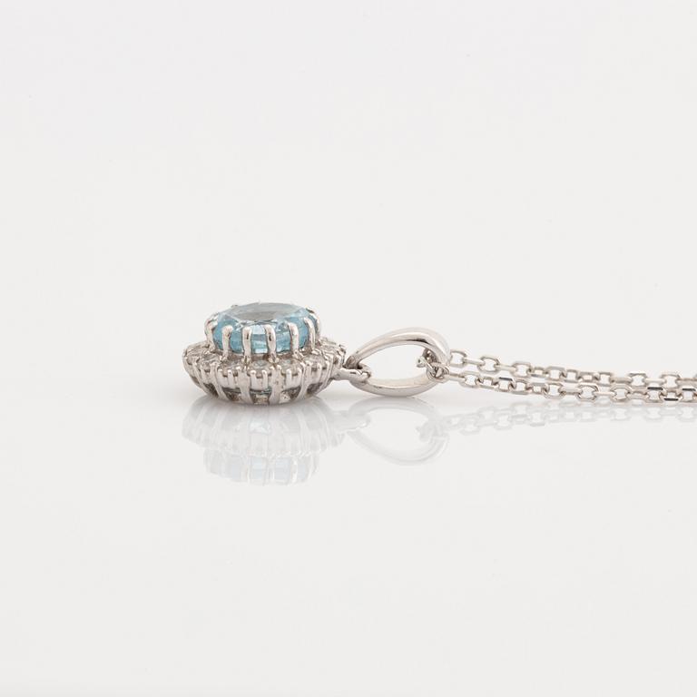 Blue topaz and brilliant cut diamond earrings and necklace.
