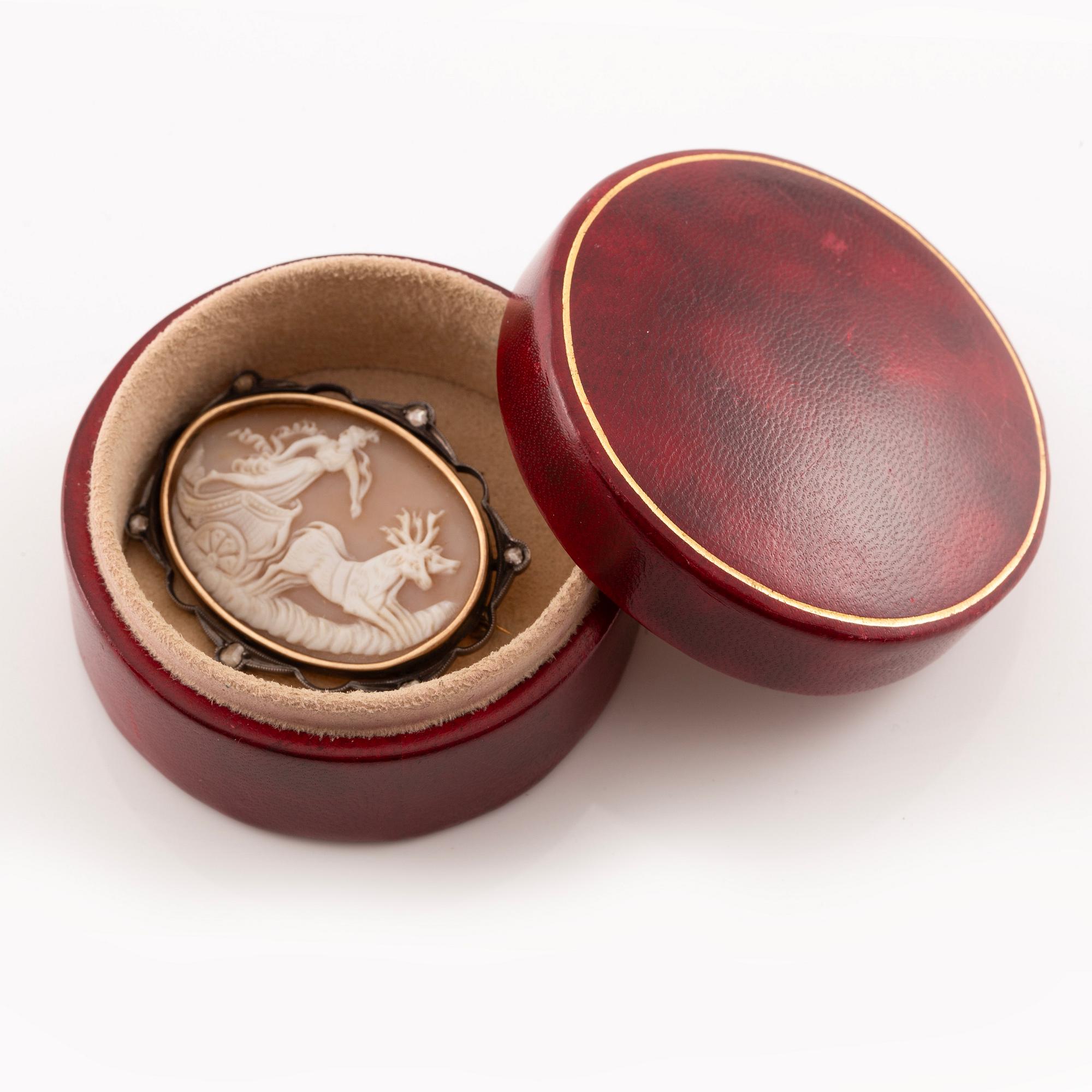 Brooch with a shell cameo, silver and 14K gold with rose-cut diamonds.