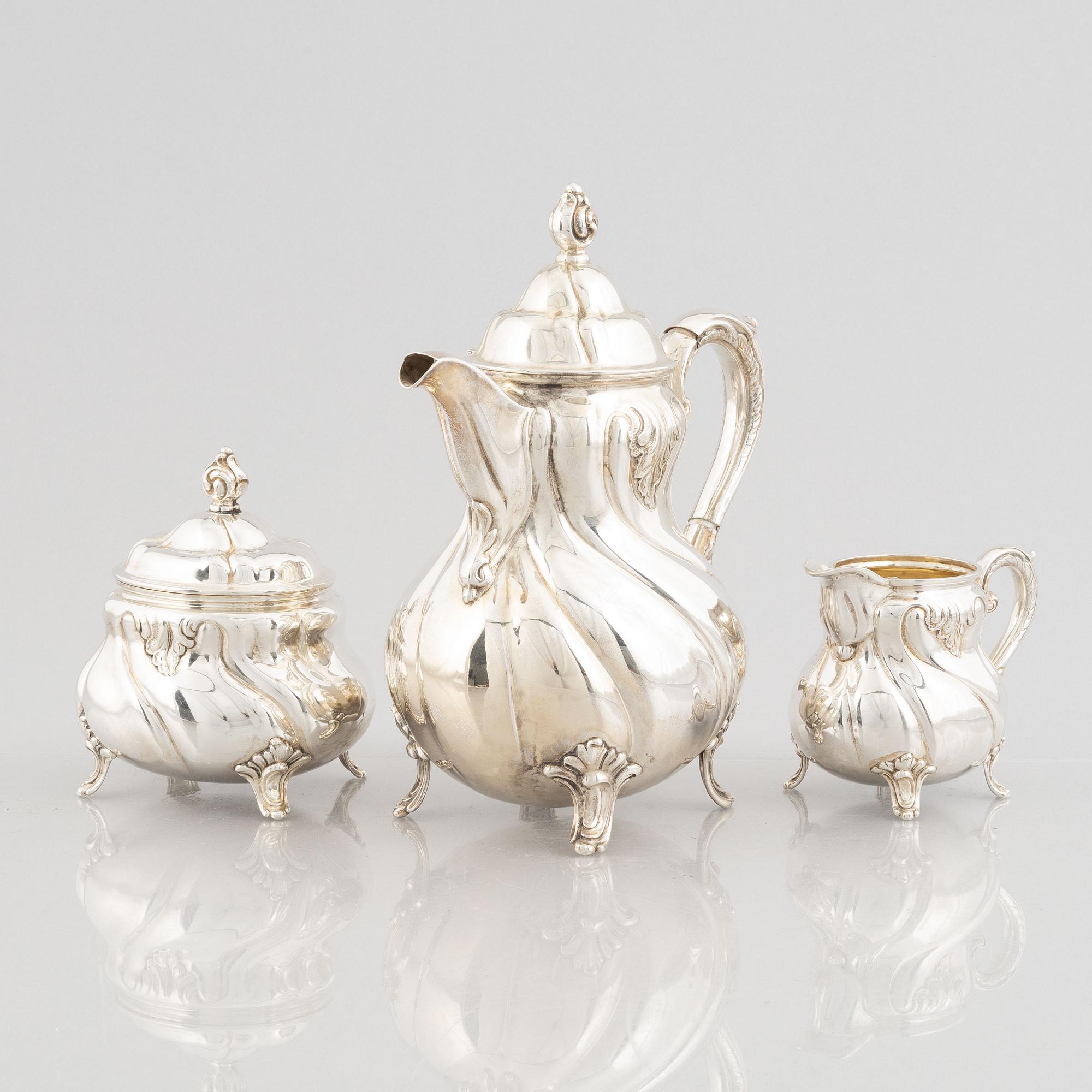 A German Rococo-Style Silver Coffee Pot, Creamer and Sugar Bowl, mark of MH Wilkens & Söhne, Bremen-Hemelingen.