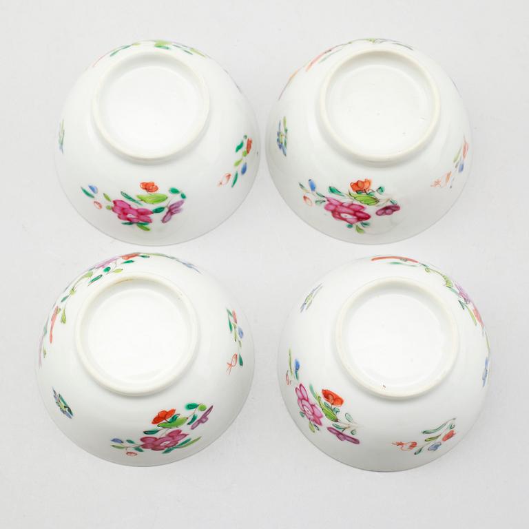 Set of three famille rose cups and saucers and a spare cup, 18th century.