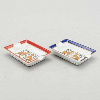 HERMÈS, a pair of porcelain ashtrays.