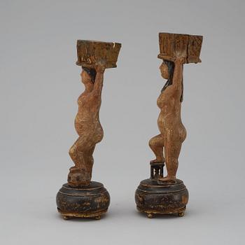 A pair of Swedish 19th century wooden candlesticks.