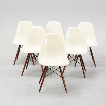 A set of six Plastic Chairs DSW with later stands, by Charles and Ray Eames.