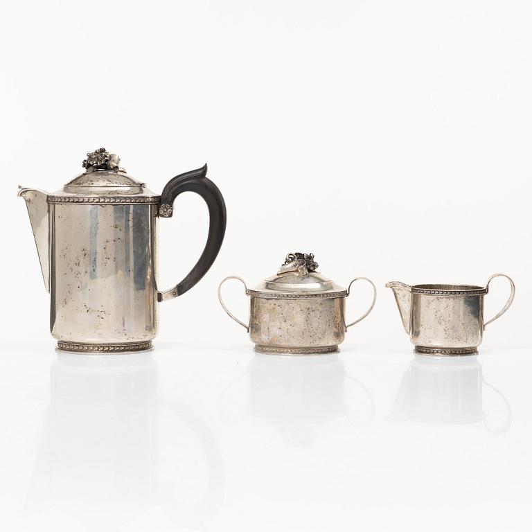 A Swedish silver coffee pot, cream jug and sugar bowl, mark of Caneman & Wallen, Stockholm 1949.