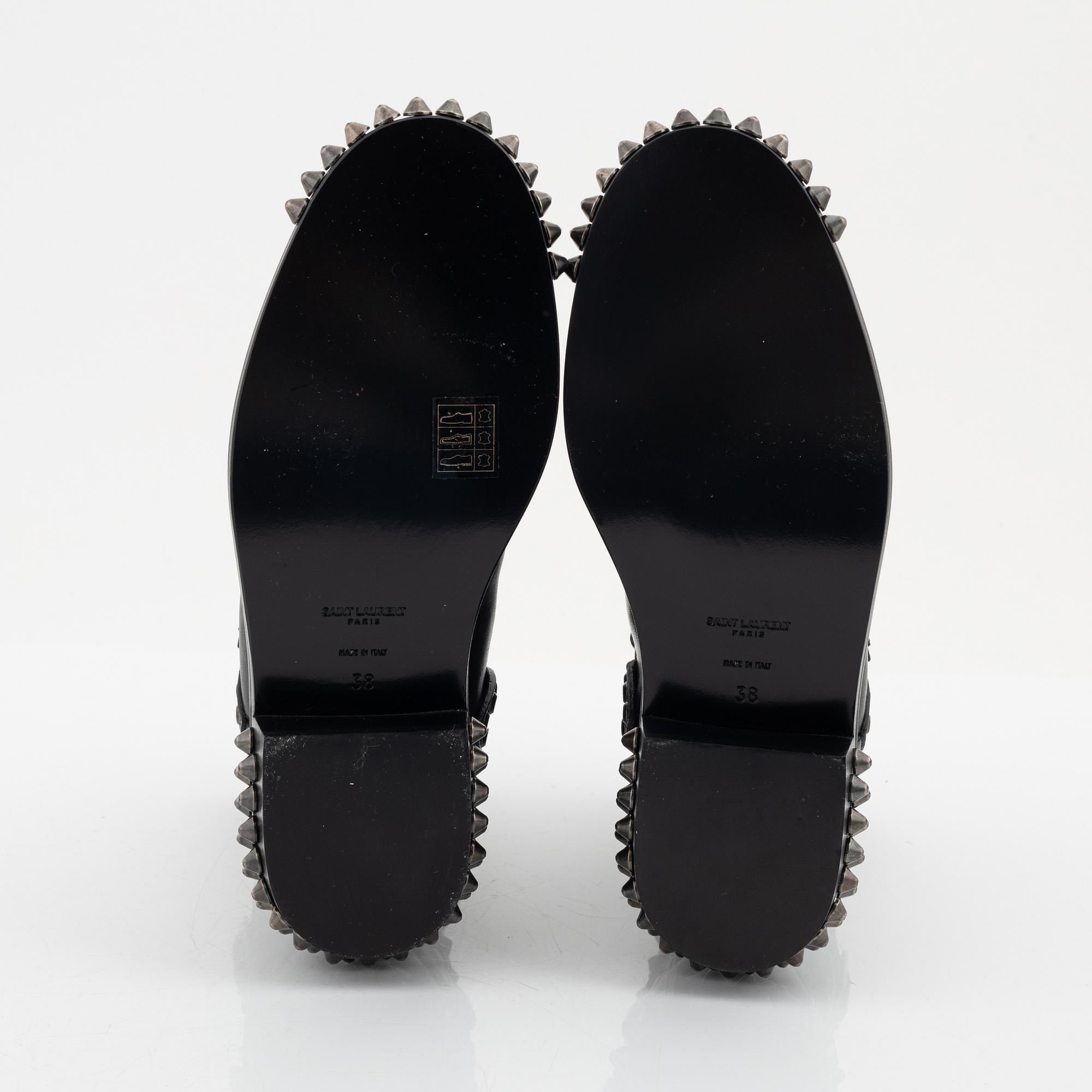 Yves Saint Laurent, a pair of black leather and studs boots, size 38.