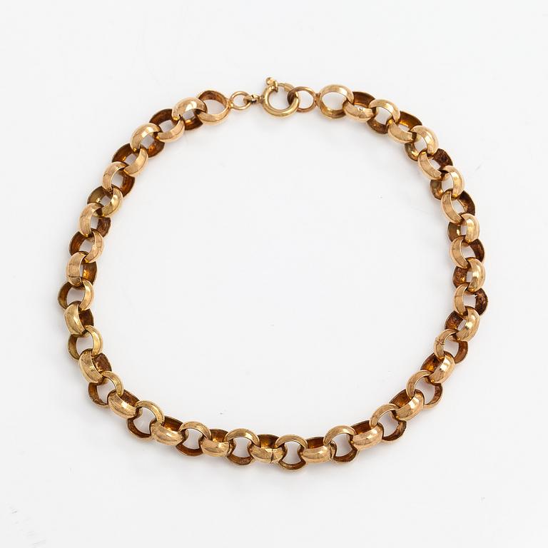 A 14K gold bracelet.