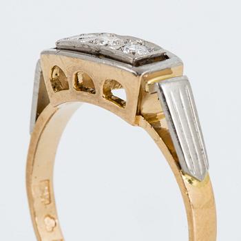18K gold and brilliant-cut diamond three-stone ring.