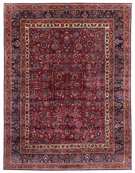 313. A Mashad carpet, signed Saber, c. 459 x 348 cm.