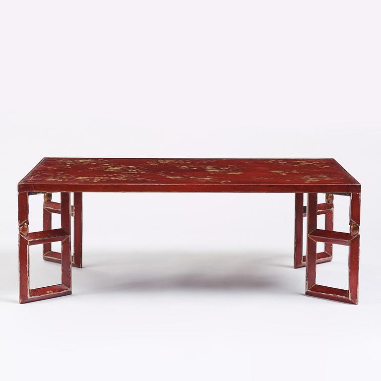 A Chinese red low table, 20th century.