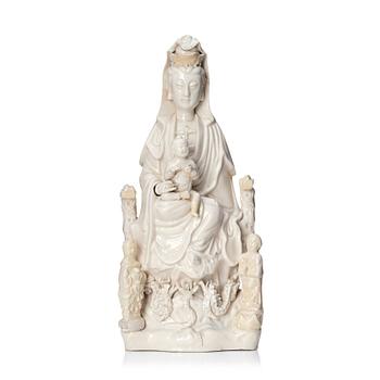 789. A Chinese blanc de chine Guanyin with attendants, Dehua, late Ming dynasty/early Qing dynasty.