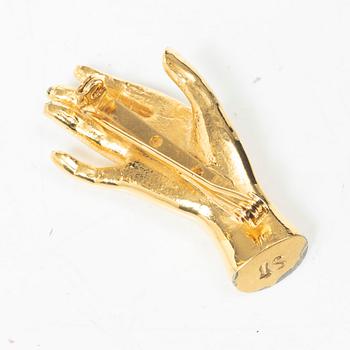 Estrid Ericson, a brooch.