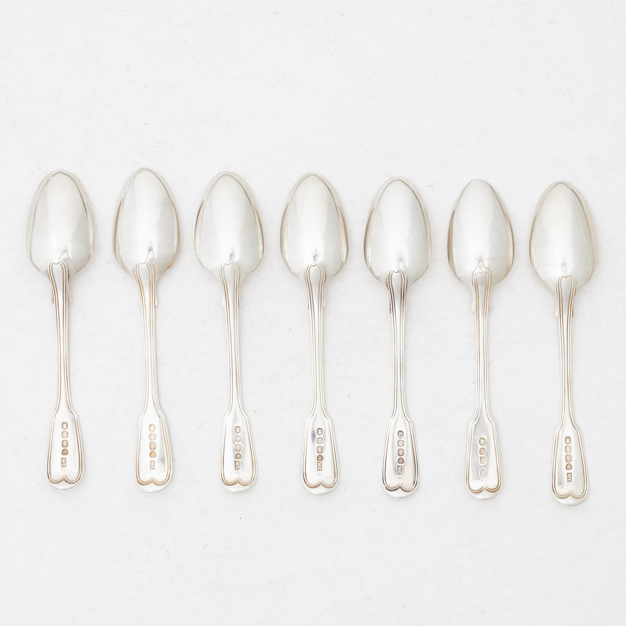Seven silver spoons, French model, mostly William Comyns, London 1916.