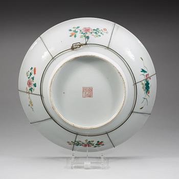 A large famille rose dish, late Qing dynasty, with Qianlong mark.