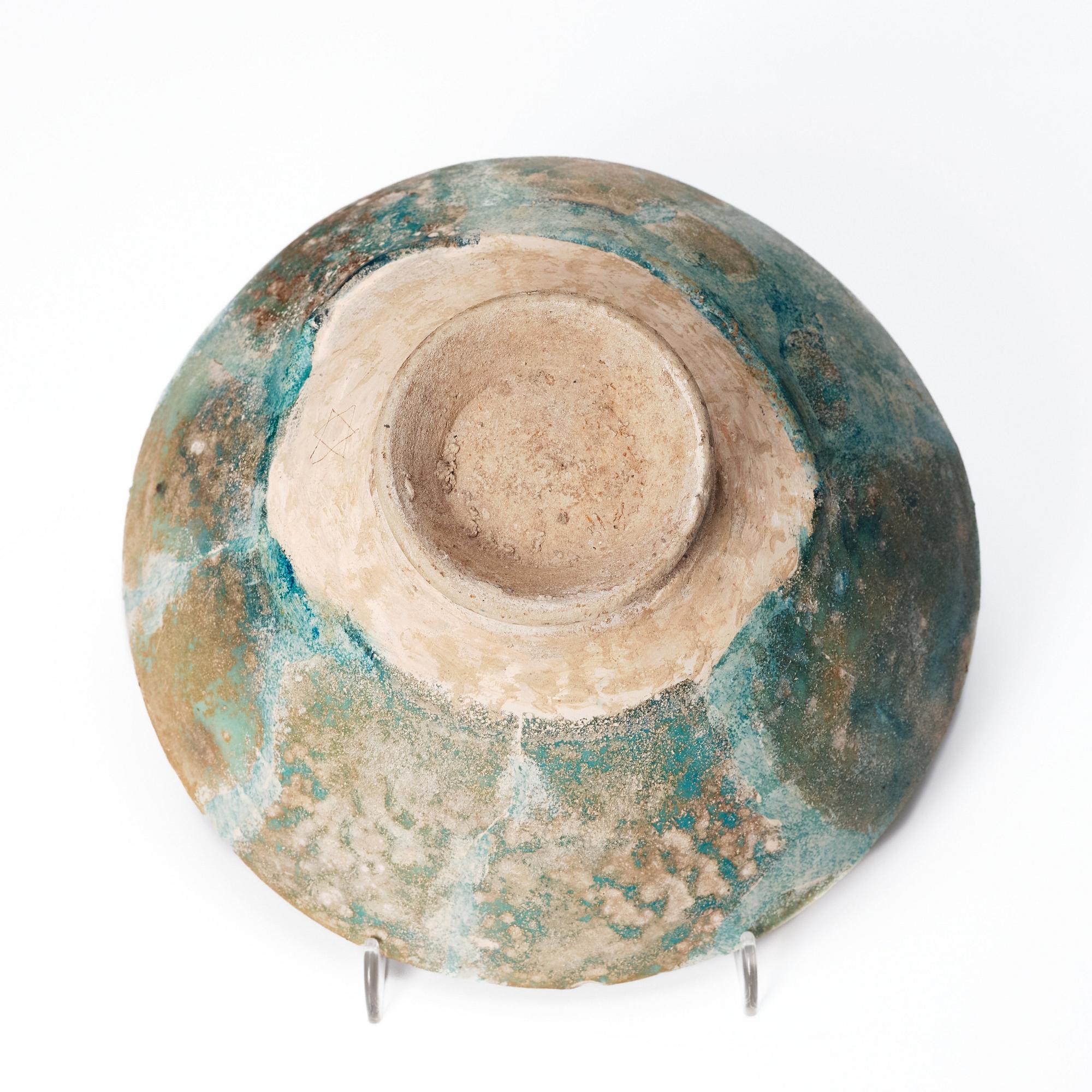 A 10-11th century Kashan Turquoise-glazed pottery bowl.
