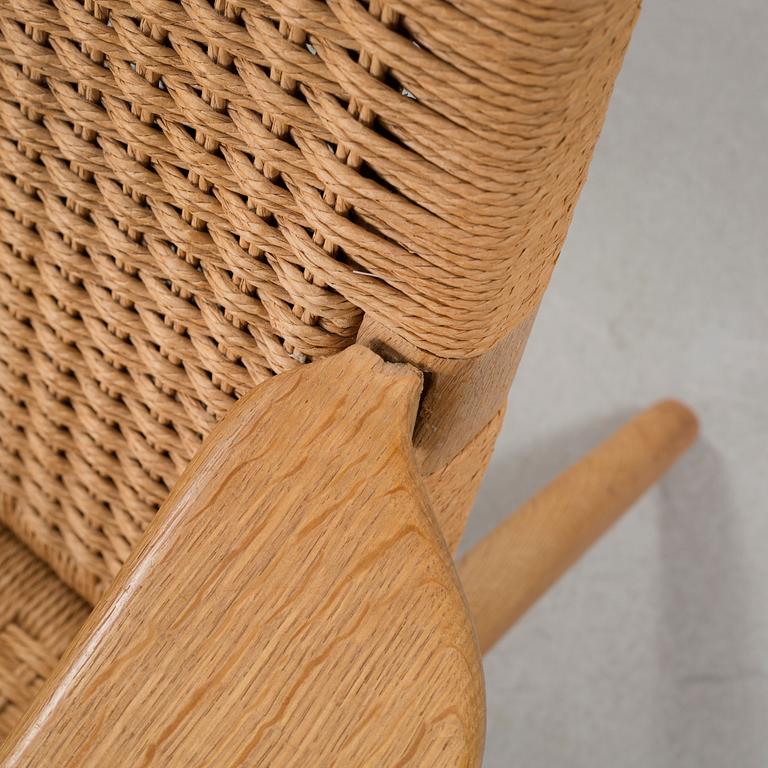 A lounge chair by Hans J Wegner, model "CH-25", for Carl Hansen & Son, Denmark, second half of the 20th century.