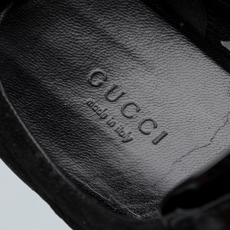 SKOR, Gucci.