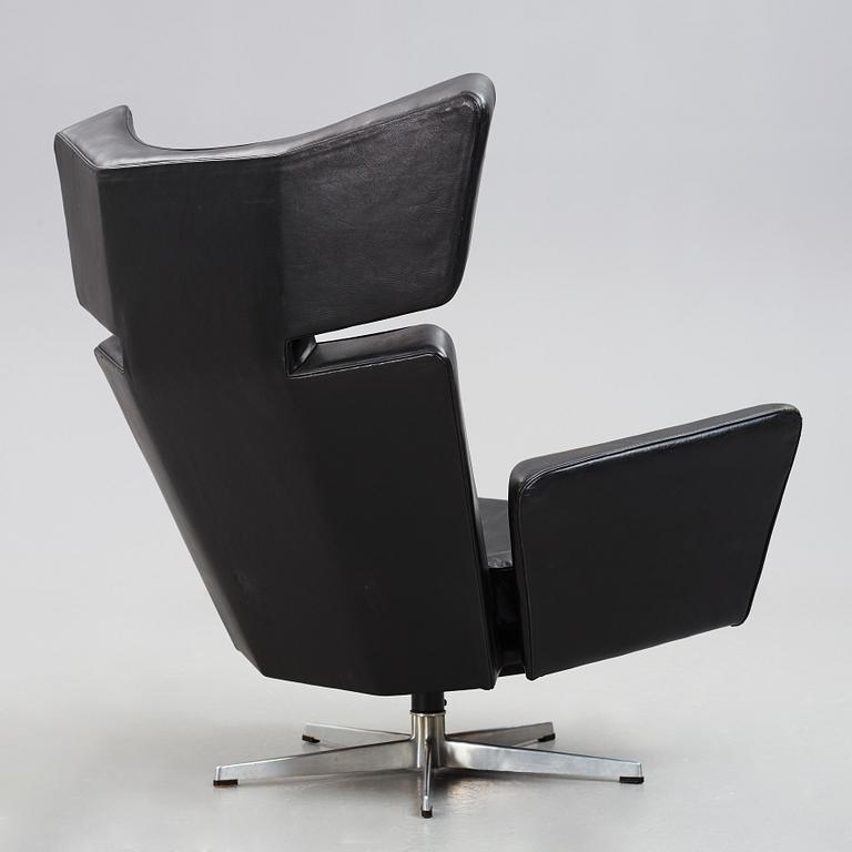 Arne Jacobsen, a black leather and aluminium "Ox-Chair", Denmark 1966.