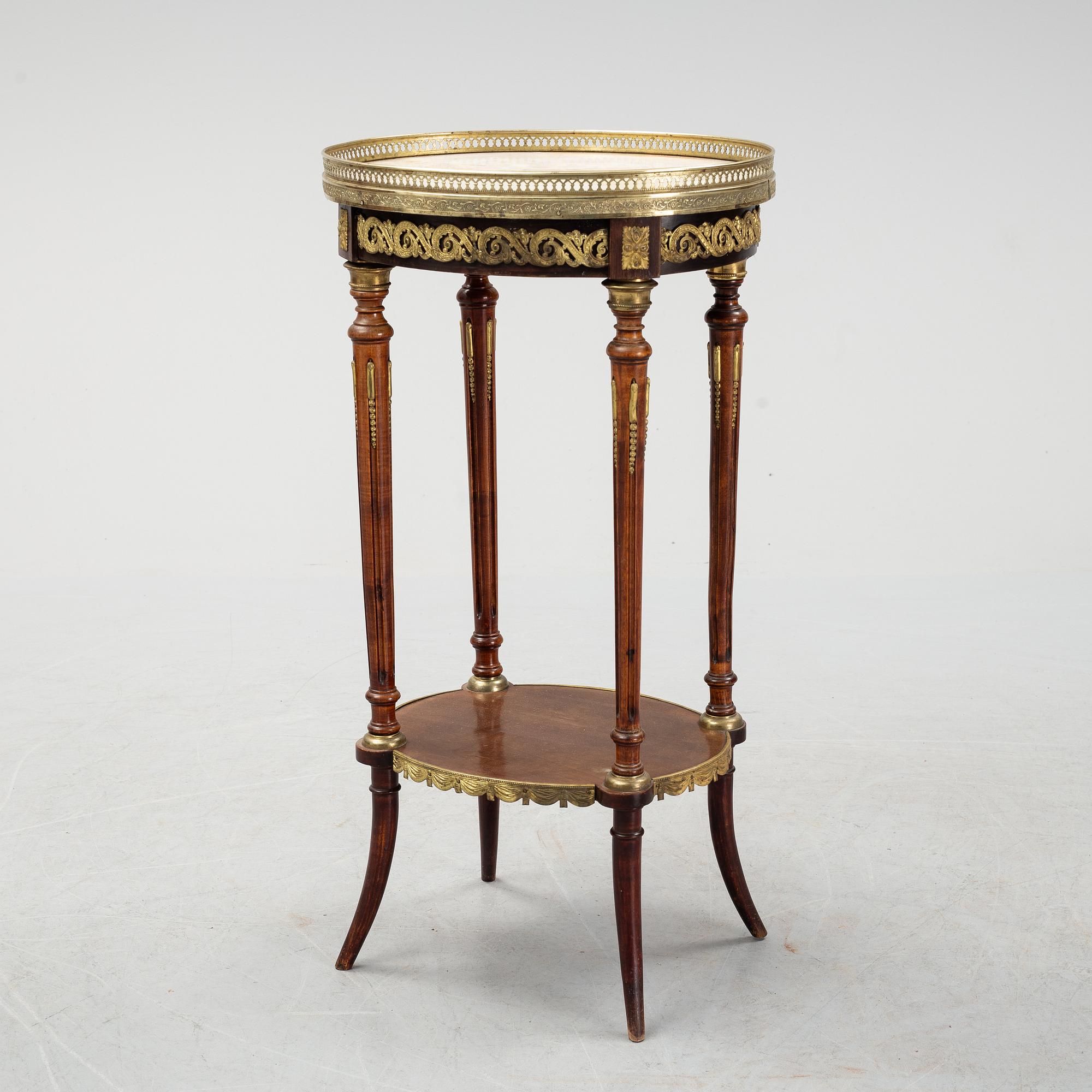 A French Louis XVI-style table, first half of the 20th century.