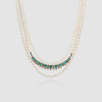 1392. A 3-strand cultured pearl necklace with an emerald, cultured pearl and diamond brooch.